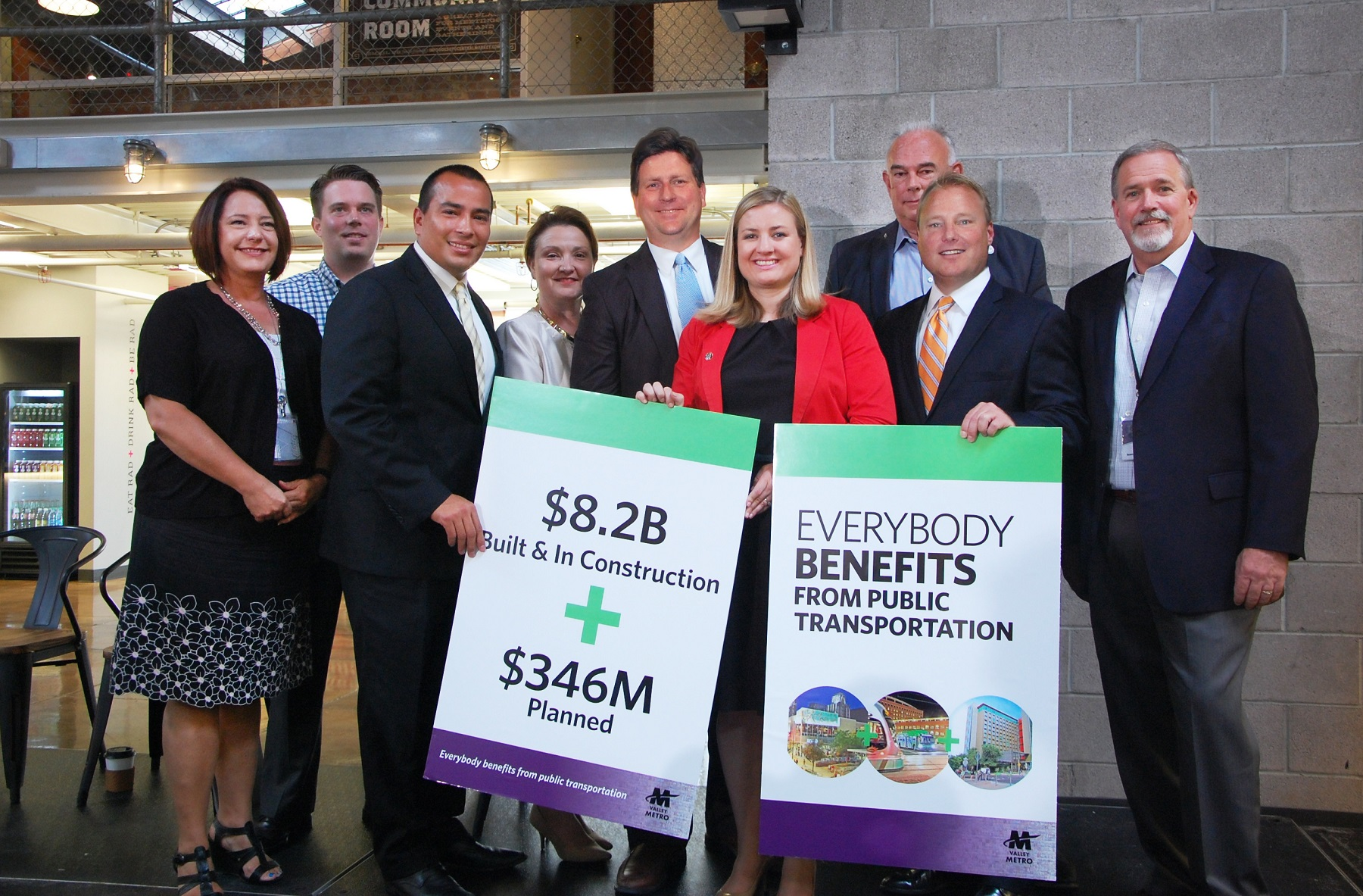 From left to right, Phoenix Public Transit Director Maria Hyatt, DeSoto Market owner Shawn Connelly, Phoenix Vice Mayor Daniel Valenzuela, Phoenix Community and Economic Development Director Christine Mackay, Phoenix Mayor Greg Stanton, Phoenix Councilmember Kate Gallego, Glendale Councilmember Gary Sherwood, Tempe Mayor Mark Mitchell and Valley Metro CEO Steve Banta.