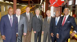 From left to right, SORTA Board Chair Jason Dunn and Vice Chair Ken Reed stand with Transdev&apos;s John Claflin (who will serve as General Manager of the Cincinnati Streetcar), Mike Setzer and Dick Alexander, along with Cincinnati Metro&apos;s Executive Vice President Darryl Haley and CEO &amp; General Manager Dwight Ferrell inside the new Maintenance and Operations Facility of the Cincinnati Streetcar.