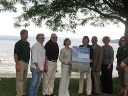 TCAT Acting General Manager Alice Eccleston, fourth from left, holds a Learn to Swim poster with Commissioner Rose Harvey, New York State Office of Parks, Recreation and Historic Preservation. TCAT Acting General Manager Alice Eccleston, fourth from left, holds a Learn to Swim poster with Commissioner Rose Harvey, New York State Office of Parks, Recreation and Historic Preservation.