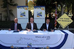 From left to right, Kevin Haboian, senior vice president, Parsons Transportation Group; Matt Scott, vice president and district manager, Kiewit Infrastructure West Co.; and Habib F. Balian, CEO of the Foothill Gold Line Construction Authority, sign the Substantial Completion Certificate for the Foothill Gold Line from Pasadena to Azusa. From left to right, Kevin Haboian, senior vice president, Parsons Transportation Group; Matt Scott, vice president and district manager, Kiewit Infrastructure West Co.; and Habib F. Balian, CEO of the Foothill Gold Line Construction Authority, sign the Substantial Completion Certificate for the Foothill Gold Line from Pasadena to Azusa.