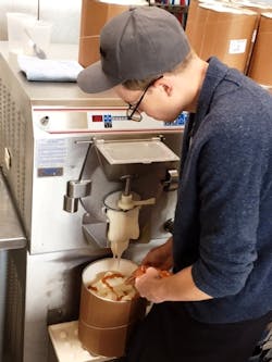 Salt & Straw head ice cream maker Tyler Malek mixes up a batch of Max Orange Line-inspired ice cream. Salt & Straw head ice cream maker Tyler Malek mixes up a batch of Max Orange Line-inspired ice cream.