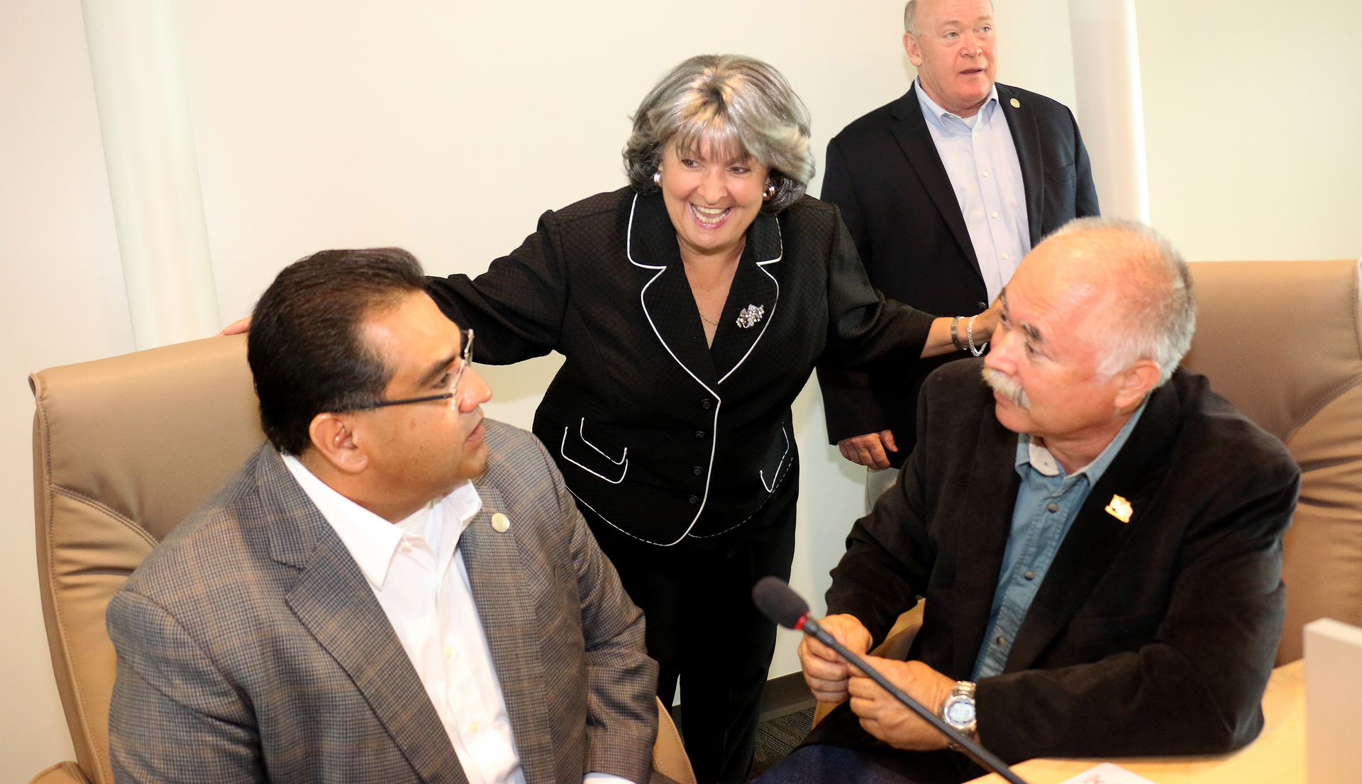 Victor Valley Transit Authority Vice-Chair and Apple Valley Mayor Pro Tem, Barb Stanton, center, welcomes the two new board members added following its merger with Barstow Area Transit, San Bernardino County Third District Supervisor James Ramos, left, and City of Barstow Councilmember Richard Harpole, right. San Bernardino County First District Supervisor Robert Lovingood, also a board member, stands center-right. The VVTA Board of Directors is now a seven-member board.