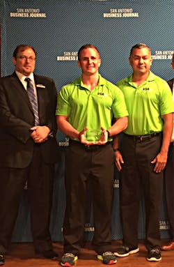 Via Wellness Coordinator Justin Cruger, center, and Via Employee Services Specialist Daniel Rodriguez, right, accept the “Healthiest Employer” award from San Antonio Business Journal Publisher Jimmy Holmes. Via Wellness Coordinator Justin Cruger, center, and Via Employee Services Specialist Daniel Rodriguez, right, accept the “Healthiest Employer” award from San Antonio Business Journal Publisher Jimmy Holmes.