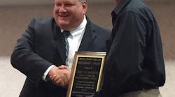Joel Gardner accepts the President&apos;s Award at the Arkansas Transit Association Conference.