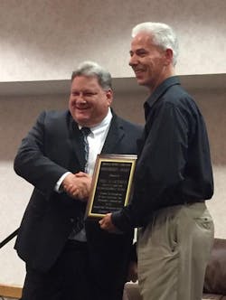 Joel Gardner accepts the President's Award at the Arkansas Transit Association Conference. Joel Gardner accepts the President's Award at the Arkansas Transit Association Conference.