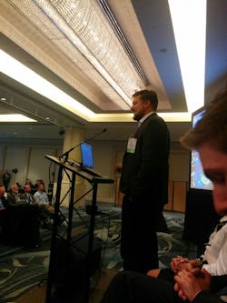 Matt Caywood, CEO of TransitScreen, addresses a crowd during the 2015 APTA Annual Meeting in San Francisco.