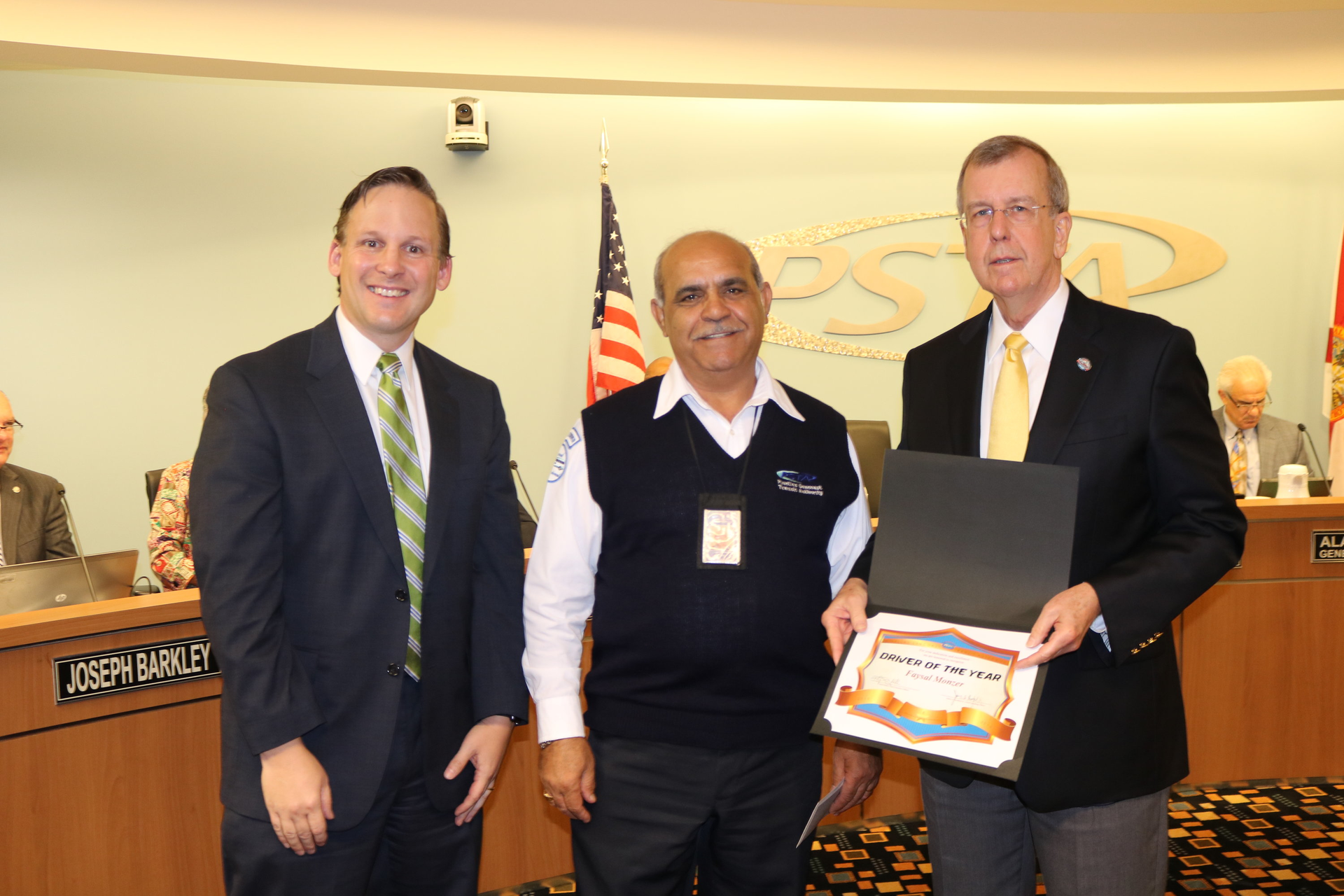 Faysal Monzer is awarded PSTA&rsquo;s 2015 Driver of the Year by PSTA CEO Brad Miller (L) and PSTA Board Chair Bill Jonson (R).