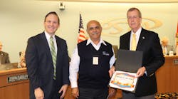 Faysal Monzer is awarded PSTA&rsquo;s 2015 Driver of the Year by PSTA CEO Brad Miller (L) and PSTA Board Chair Bill Jonson (R).