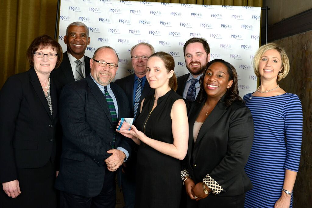 Cincinnati Metro's External Affairs Team won the Cincinnati chapter's P.R.S.A. Communication Team of the Year Award. From left to right, Vice President of External Affairs Sallie Hilvers, Marketing and Communications Director Dave Etienne, Marketing Communications Coordinator Michelle Reeves, Public Relations Manager Brandy Jones and Graphic Designer Suzanne Gilkey; back row from left to right, CEO & GM Dwight Ferrell, Graphic Designer Supervisor Dave Warning and E-Media Coordinator Alex Reed.