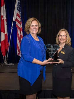 Lynn Cohoe, left, accepts the 2015 Senior Safety Professional Award from Kathy Tull, board member from the Canadian Society of Safety Engineering. Lynn Cohoe, left, accepts the 2015 Senior Safety Professional Award from Kathy Tull, board member from the Canadian Society of Safety Engineering.