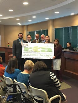 Commuter Advertising presents a check to the Greater Dayton Regional Transit Authority. Commuter Advertising presents a check to the Greater Dayton Regional Transit Authority.