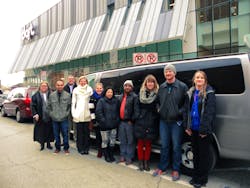 Representatives from Central Iowa Shelter & Services, U.S. Committee for Refugees and Immigrants, ArtForceIowa and DART stand in front of one of the donated RideShare vans. Representatives from Central Iowa Shelter & Services, U.S. Committee for Refugees and Immigrants, ArtForceIowa and DART stand in front of one of the donated RideShare vans.