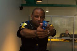 DART Police Sergeant Donovon Collins aims at a suspect in the use-of-force simulator. DART Police Sergeant Donovon Collins aims at a suspect in the use-of-force simulator.