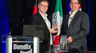 Berend Bracht, president and CEO at Bendix Commercial Vehicle Systems, accepts the Navistar Diamond Supplier award from Pat Morello, Navistar&rsquo;s director of chassis procurement.