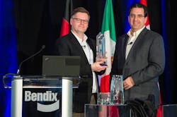 Berend Bracht, president and CEO at Bendix Commercial Vehicle Systems, accepts the Navistar Diamond Supplier award from Pat Morello, Navistar&rsquo;s director of chassis procurement.