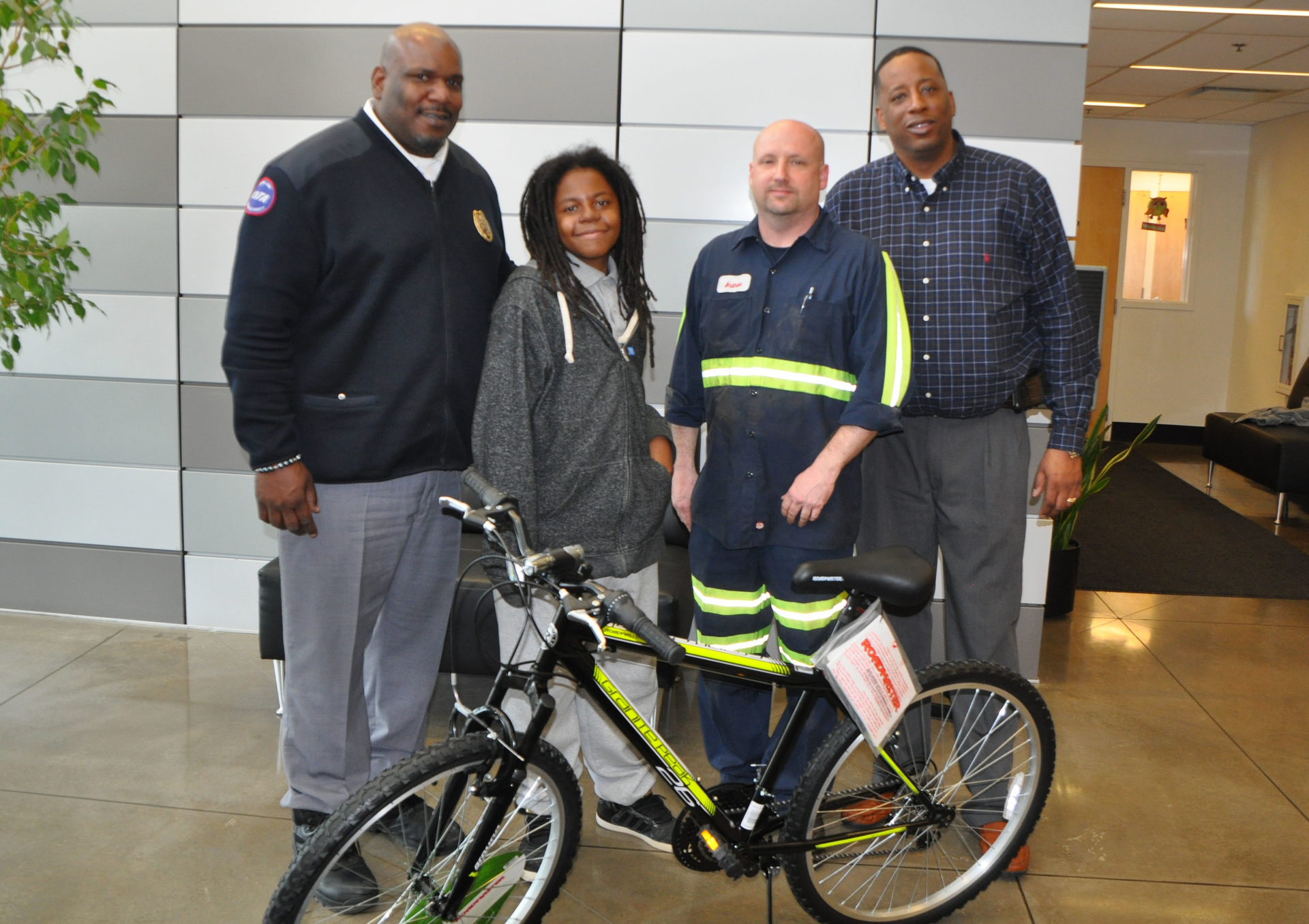 Pictured left to right: Andre Peterson, COTA transportation services supervisor; Osman Mayo; Andrew Riley, COTA coach repair; and Jimmy Pugh, COTA vehicle maintenance supervisor.