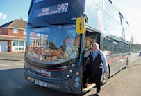Birmingham City Councillor Keith Linnecor with a National Express Platinum bus.