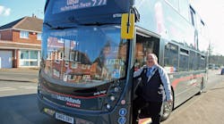 Birmingham City Councillor Keith Linnecor with a National Express Platinum bus.