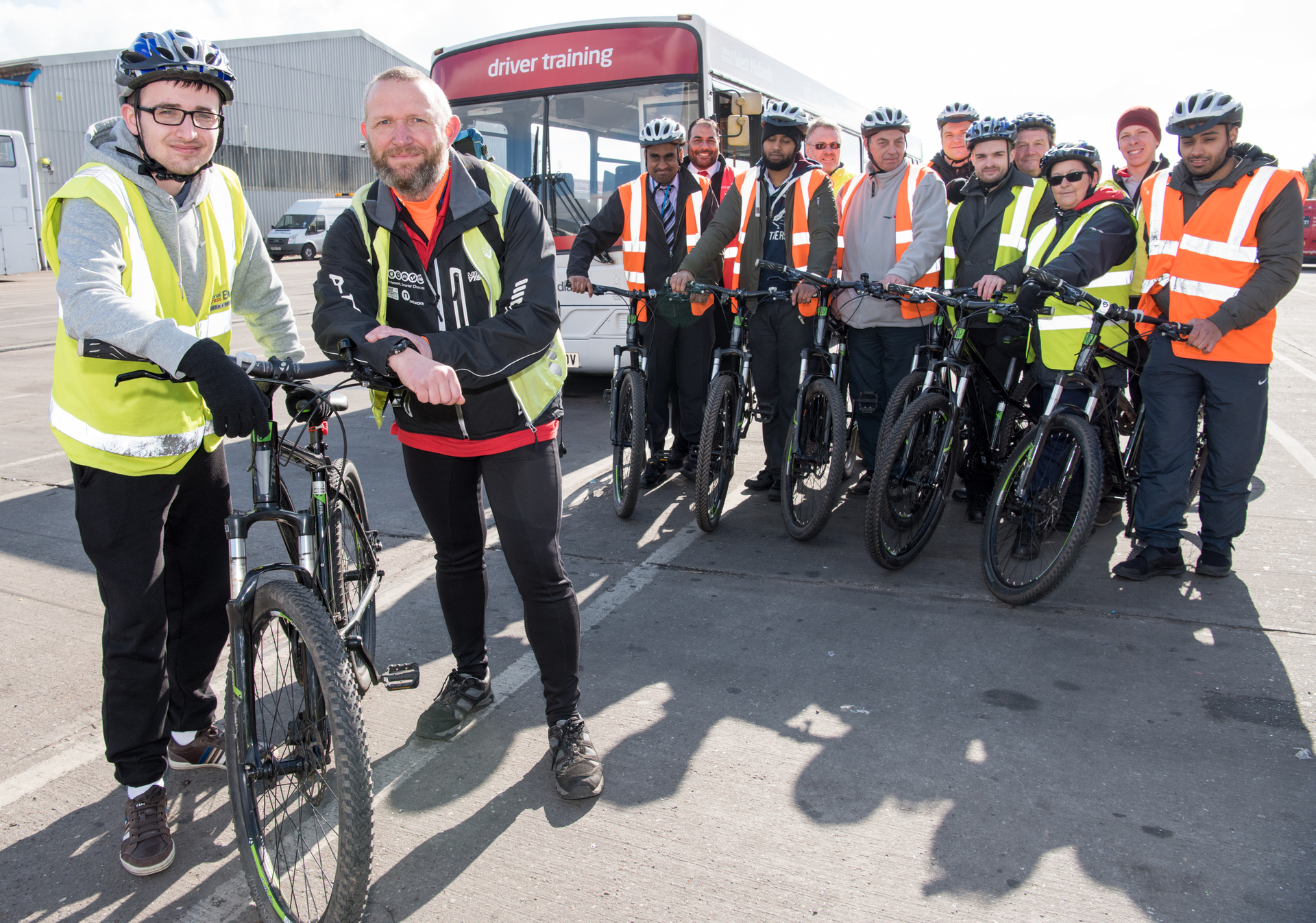 Trainee bus driver Jack Yates with BikeRight! instructor Phil Inamorata and colleagues on the 2WheelsAware course.