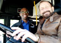 St. Cloud Metro Bus Executive Director Ryan Daniel coaches one of the delegates from Spalt through the roadeo course.