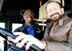 St. Cloud Metro Bus Executive Director Ryan Daniel coaches one of the delegates from Spalt through the roadeo course.