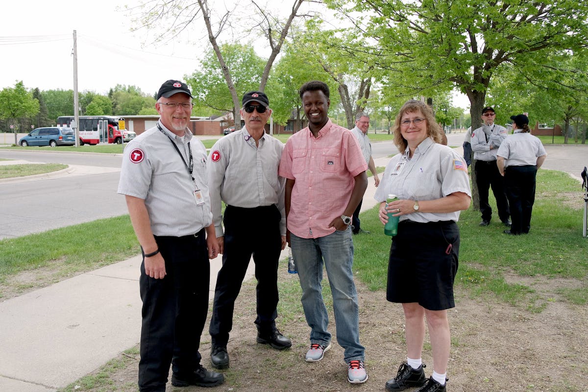 Metro Bus Fixed Route drivers visit before the competition. Shon Davis (far left) placed third. Gayle Rekowski (far right) placed first. Adam Ploof (not pictured) placed second in the large bus division.