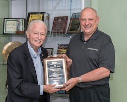 Accepting the award are Tracer Products’ Gary Testa (right), featured with Spectronics’ founder and chairman Bill Cooper (left). In 1955, Cooper invented fluorescent leak detection for the automotive industry. Accepting the award are Tracer Products’ Gary Testa (right), featured with Spectronics’ founder and chairman Bill Cooper (left). In 1955, Cooper invented fluorescent leak detection for the automotive industry.