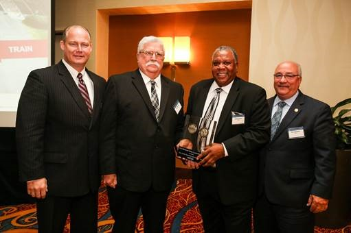 Metra Chief Safety and Environmental Officer Hilary Konczal (left to right), Metra Police Lieutenant Tom Donegan and Metra Public Safety Coordinator Larry Green and Metra Executive Director/CEO Don Orseno pause for a photo May 26 at the American Association of Railroads (AAR) Leadership Forum in Washington, D.C. Donegan and Green were recognized by the AAR for their contributions to rail safety education.