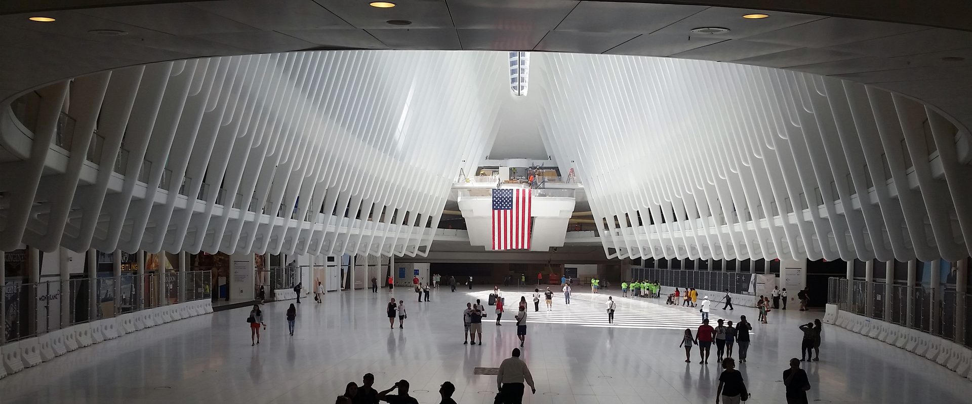 The World Trade Center Transportation Hub was designed by architect Santiago Calatrava. The large, open mezzanine is under the National September 11 Memorial plaza.