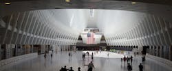 The World Trade Center Transportation Hub was designed by architect Santiago Calatrava. The large, open mezzanine is under the National September 11 Memorial plaza.