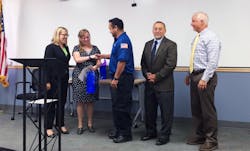 Committee on Accessible Transportation Chairperson Holly Ferrin honors bus operator Richard Montoya. Committee on Accessible Transportation Chairperson Holly Ferrin honors bus operator Richard Montoya.