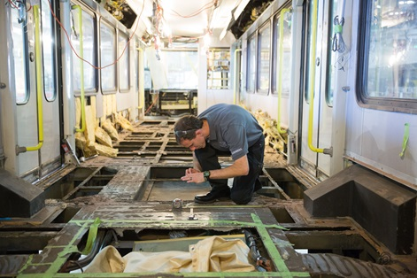 A Siemens service employee works on modernizing a Calgary Transit light rail vehicle at Siemens new Sacramento service headquarters.