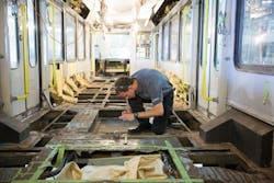 A Siemens service employee works on modernizing a Calgary Transit light rail vehicle at Siemens new Sacramento service headquarters. A Siemens service employee works on modernizing a Calgary Transit light rail vehicle at Siemens new Sacramento service headquarters.