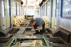 A Siemens service employee works on modernizing a Calgary Transit light rail vehicle at Siemens new Sacramento service headquarters.