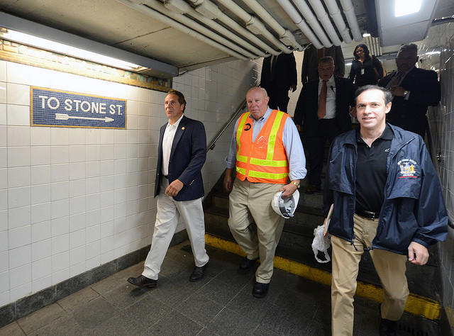 Governor Andrew M. Cuomo, MTA Chairman & CEO Thomas F. Prendergast and NYS Department of Health Commissioner Howard A. Zucker, M.D. placed anti-mosquito larvicide in an area of standing water at the Whitehall St station on Tue., August 2, 2016.