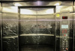 Elevator cab vandalism. Elevator cab vandalism.