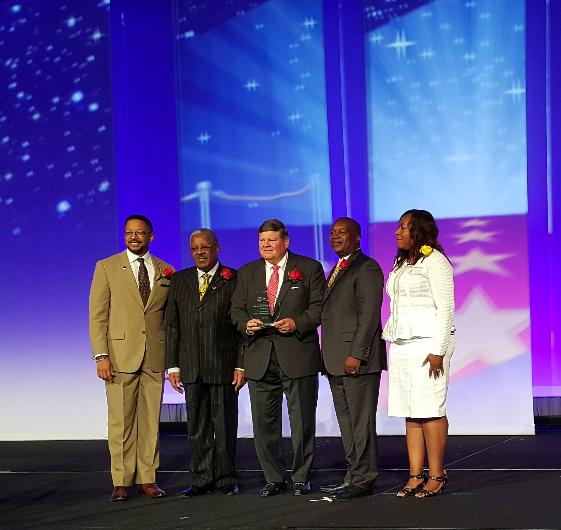 (l-r) Kevin Holzendorf (JTA Board of Directors Secretary); Isaiah Rumlin (JTA Board of Directors Vice Chair); Scott L. McCaleb (JTA Board of Directors Chairman); Nathaniel P. Ford Sr. (JTA Chief Executive Officer) and awards presenter Bacarra Sanderson Mauldlin (Birmingham-Jefferson County Transit Authority).