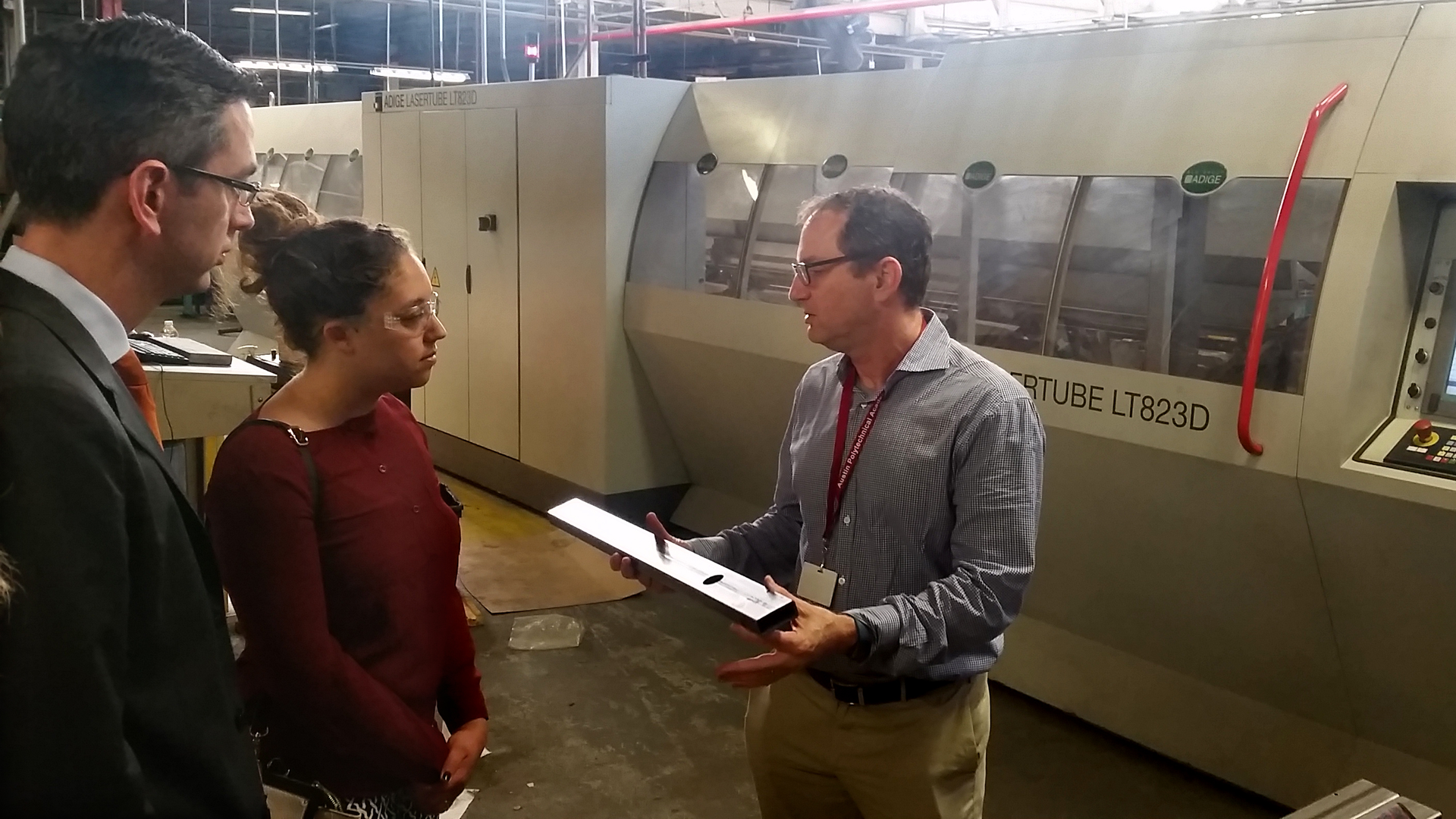 Freedman Seating Co. President Craig Freedman speaking to U.S. Department of Commerce Deputy Assistant Secretary Ted Dean and Mass Transit Assistant Editor Maile Bucher during a tour of the facility.