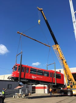 Bragg Crane Service lifting U2 Trolley car.