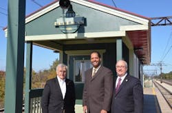 Historic Pullman Foundation President Michael Shymanski (from left), Ald. Anthony Beale (9th) and Metra Executive Director/CEO Don Orseno pose in front of the new warming house at the renovated 111th St./Pullman Station on the Metra Electric Line.