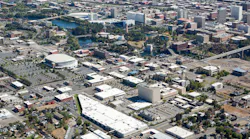 Aerial image of downtown Spokane with STA administrative offices and bus garages where all buses and paratransit vans are parked inside overnight. Read more on the downtown STA Plaza renovation at MassTransitmag.com/12272829.
