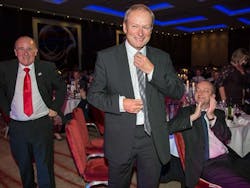 Bus driver Dave Gerrard and Managing Director Peter Coates going up to receive the National Transport Award for Bus Operator of the Year 2016. Bus driver Dave Gerrard and Managing Director Peter Coates going up to receive the National Transport Award for Bus Operator of the Year 2016.