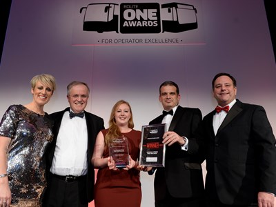 National Express' Fay Cowie and Paul Thomas receive their award from BBC Breakfast's Steph McGovern.