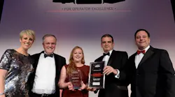 National Express' Fay Cowie and Paul Thomas receive their award from BBC Breakfast's Steph McGovern.