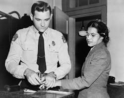 “Woman Fingerprinted.” New York World-Telegram & Sun Collection. “Woman Fingerprinted.” New York World-Telegram & Sun Collection.