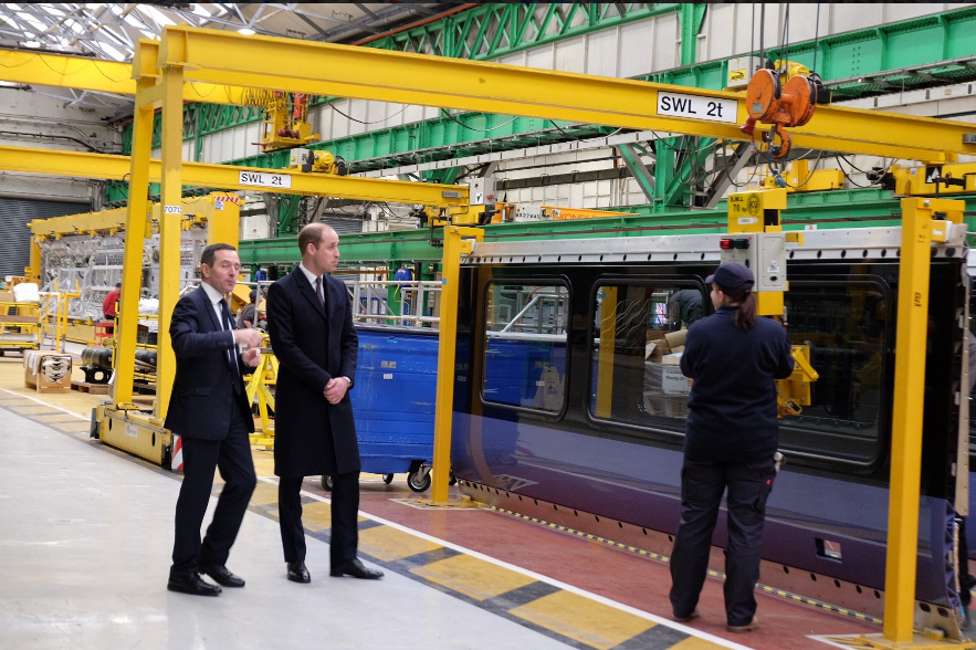 The Duke meeting apprentices & former apprentices to see how the trains are constructed at the Bombardier Rail factory in the city.