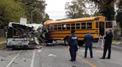 The final position of the transit bus and school bus. The school bus first impacted a passenger vehicle before crossing the center lane and colliding with the transit bus.