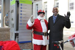 Metro CEO Dwight A. Ferrell had a little help from Bicycle Santa passing out stocking filled with goodies to thank all the 'good boys and girls' who know riding Metro is the best way to go all year long. Metro CEO Dwight A. Ferrell had a little help from Bicycle Santa passing out stocking filled with goodies to thank all the 'good boys and girls' who know riding Metro is the best way to go all year long.
