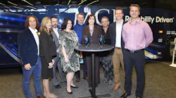 Winners gathered with MCI at the company's booth are from left: David Kestenbaum, who developed eRating, a program of the University of Vermont's Certification for Sustainable Transportation; Elaine Fickett, president H & L Charter, Ian Smart, MCI President; Jodie Merritt, vice president H & L Charter; Patrick Scully, MCI Executive Vice President of Sales and Marketing; Pat Ziska, MCI Vice President of New Coach Sales; TJ Morgan, president of Citizen Auto Stage, Tucson, Arizona, and Chair of the ABA environmental committee, along with Arrow Stages Lin.