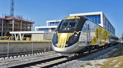 BrightBlue, the first Brightline trainset, passes by the Brightline West Palm Beach Station for the first time.